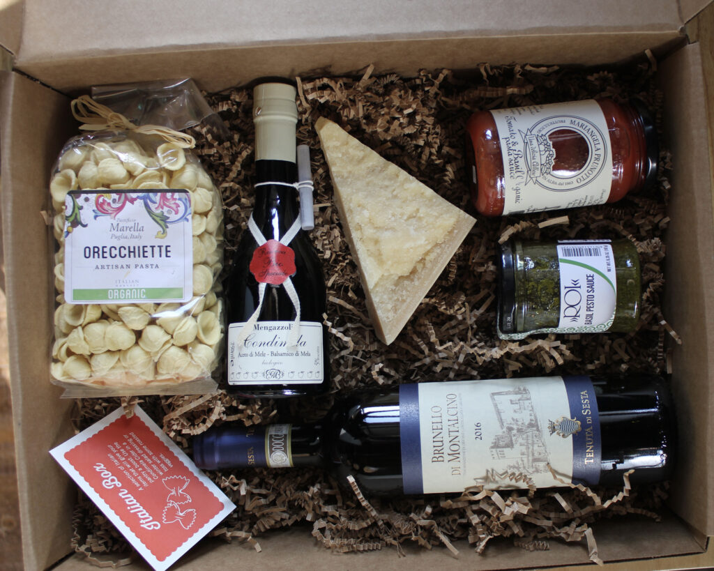 Box with pasta, cheese, and various sauces and wines