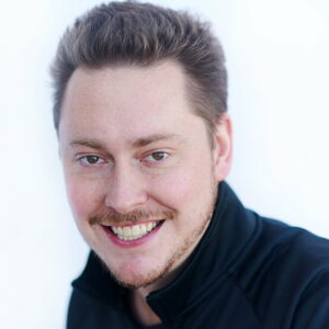 Headshot of smiling man.