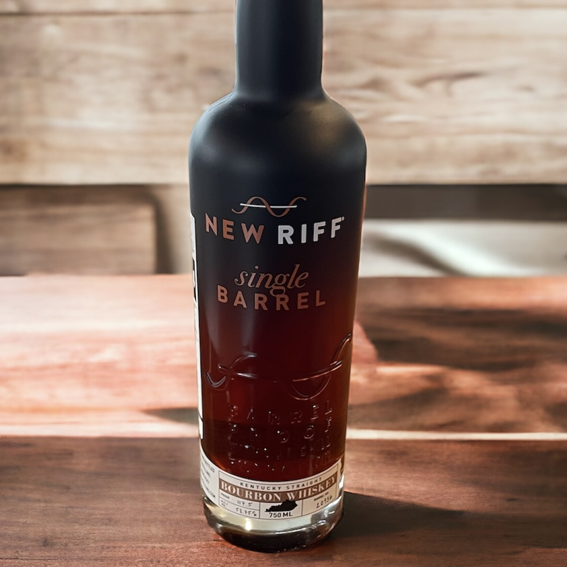 Bottle of New Riff Bourbon on wooden table