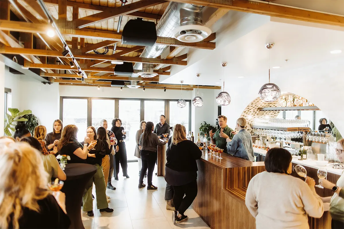 a lively space with people drinking cocktails
