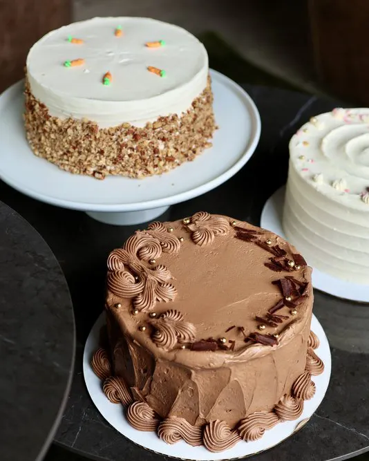 cakes sitting on trays