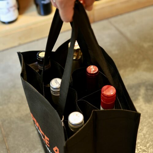 6 bottles in a black wine bag