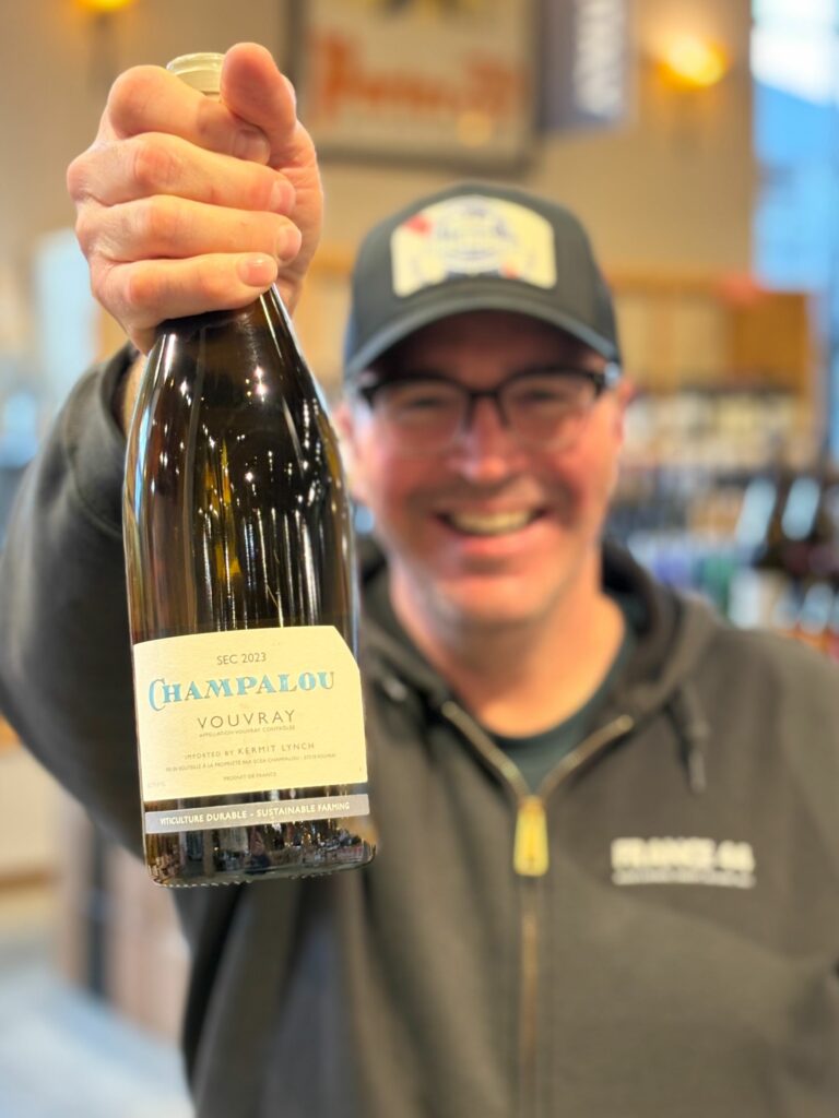 Bill holding up a bottle of Champalou Vouvray