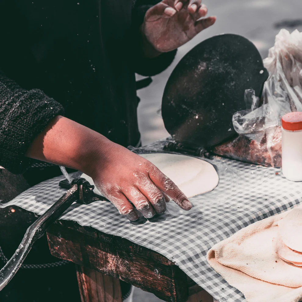 pressing tortillas