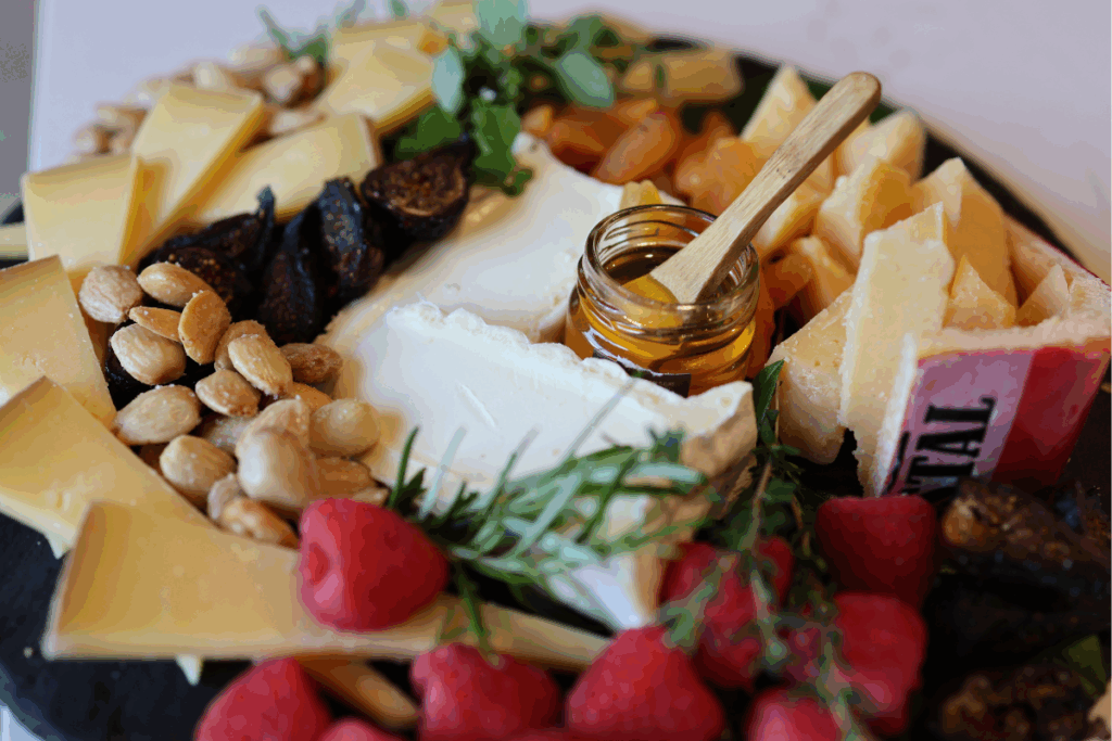 Cheeseboard with almonds and honey