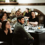 group sitting at a banquet table for dinner
