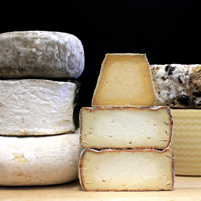 Stacks of cheese - all varieties, black background