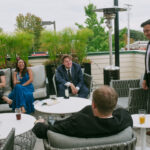 People sitting around enjoying drinks on the patio