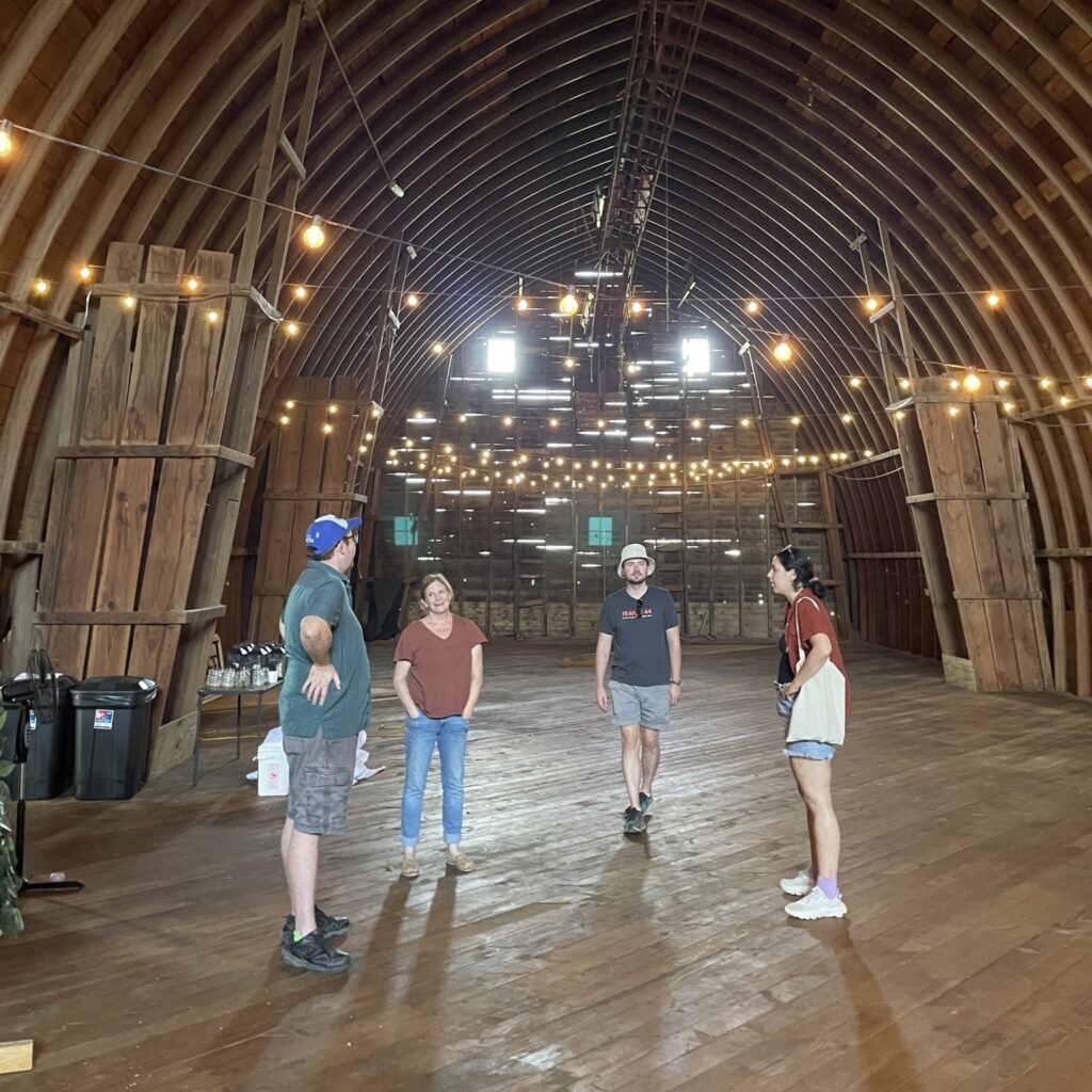 Cheesemongers in a barn at Shepherd's Way Farm with Jodi