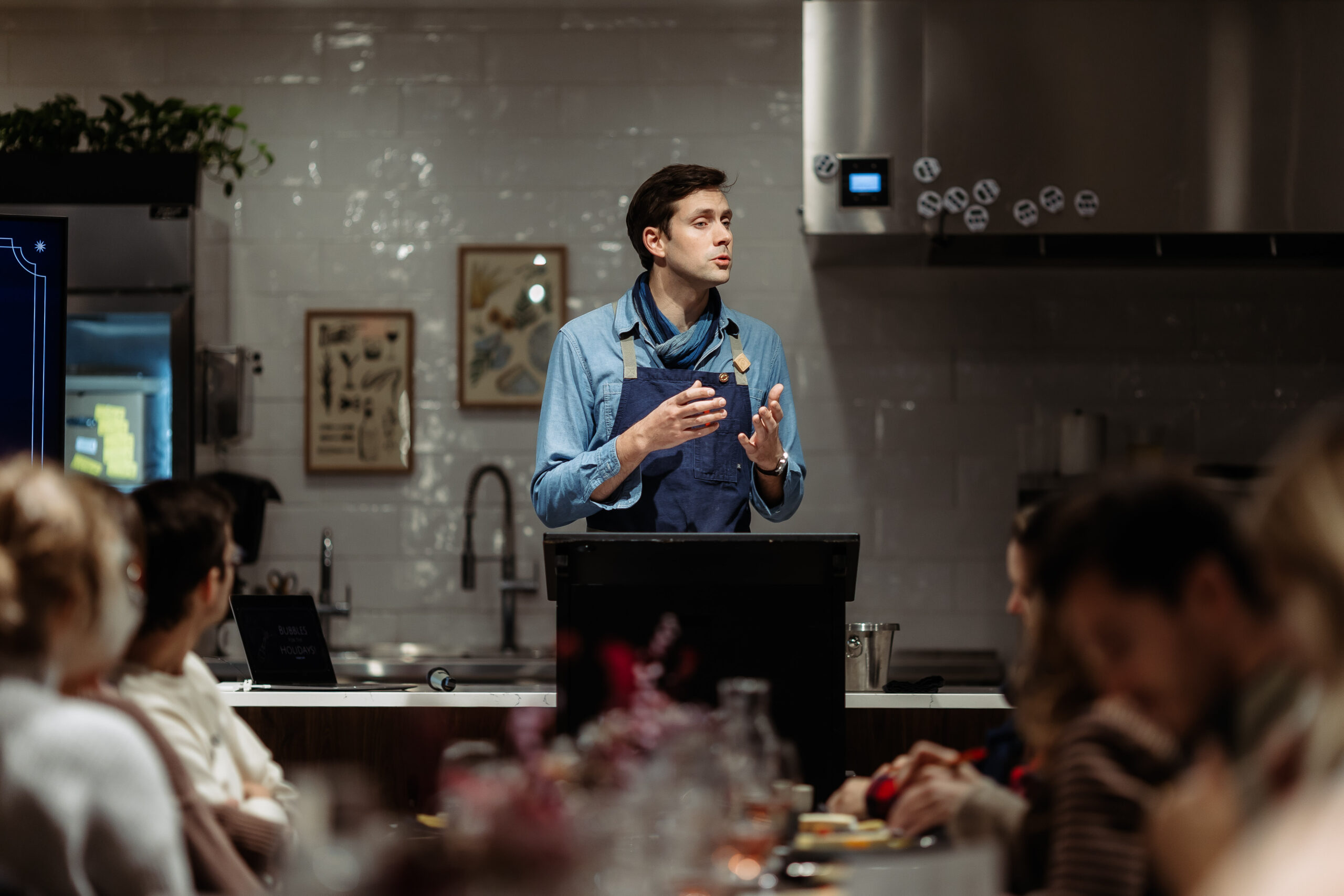 Austin giving opening remarks at a wine class