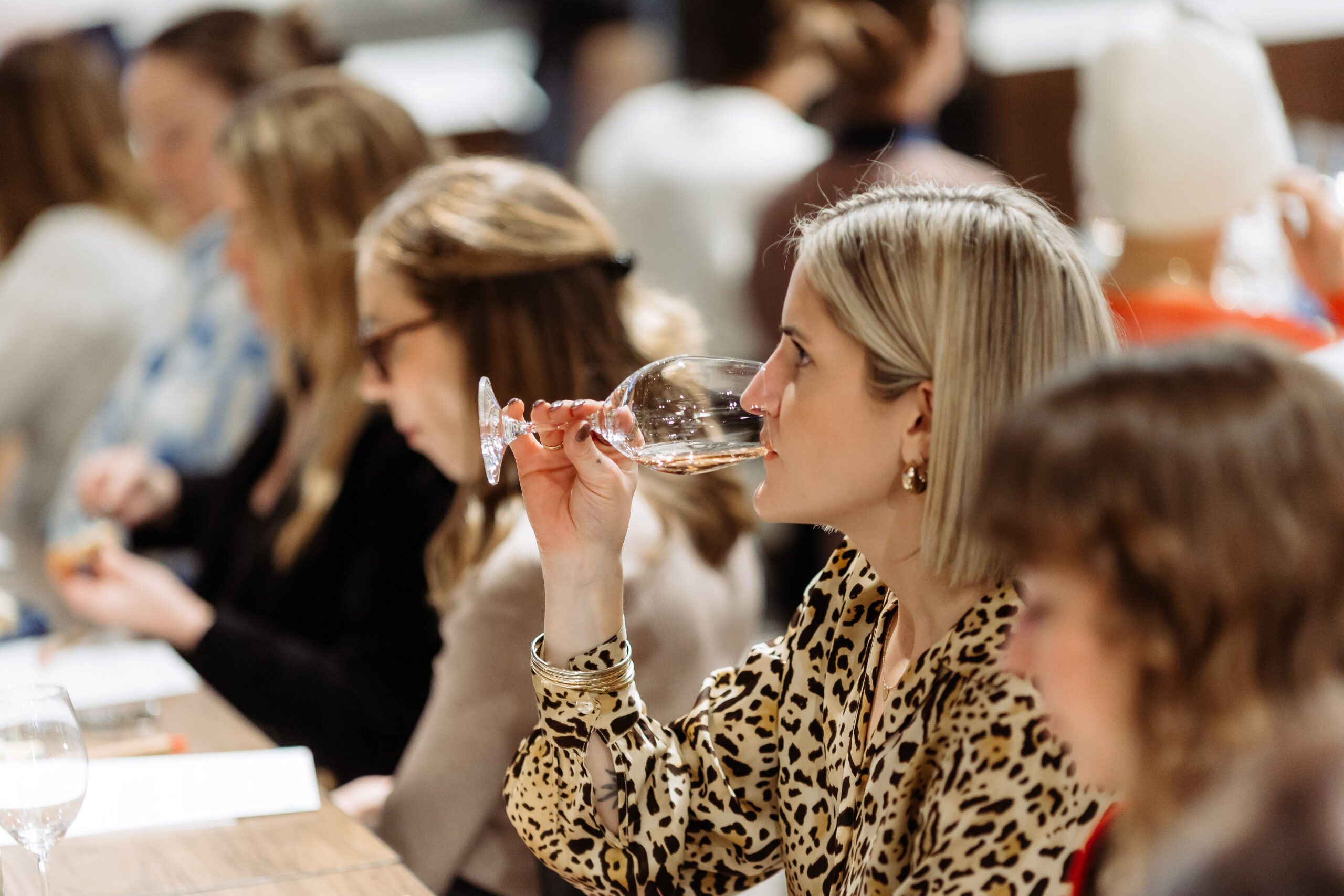 Person drinking wine at a tasting