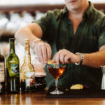 Bartender mixes a drink