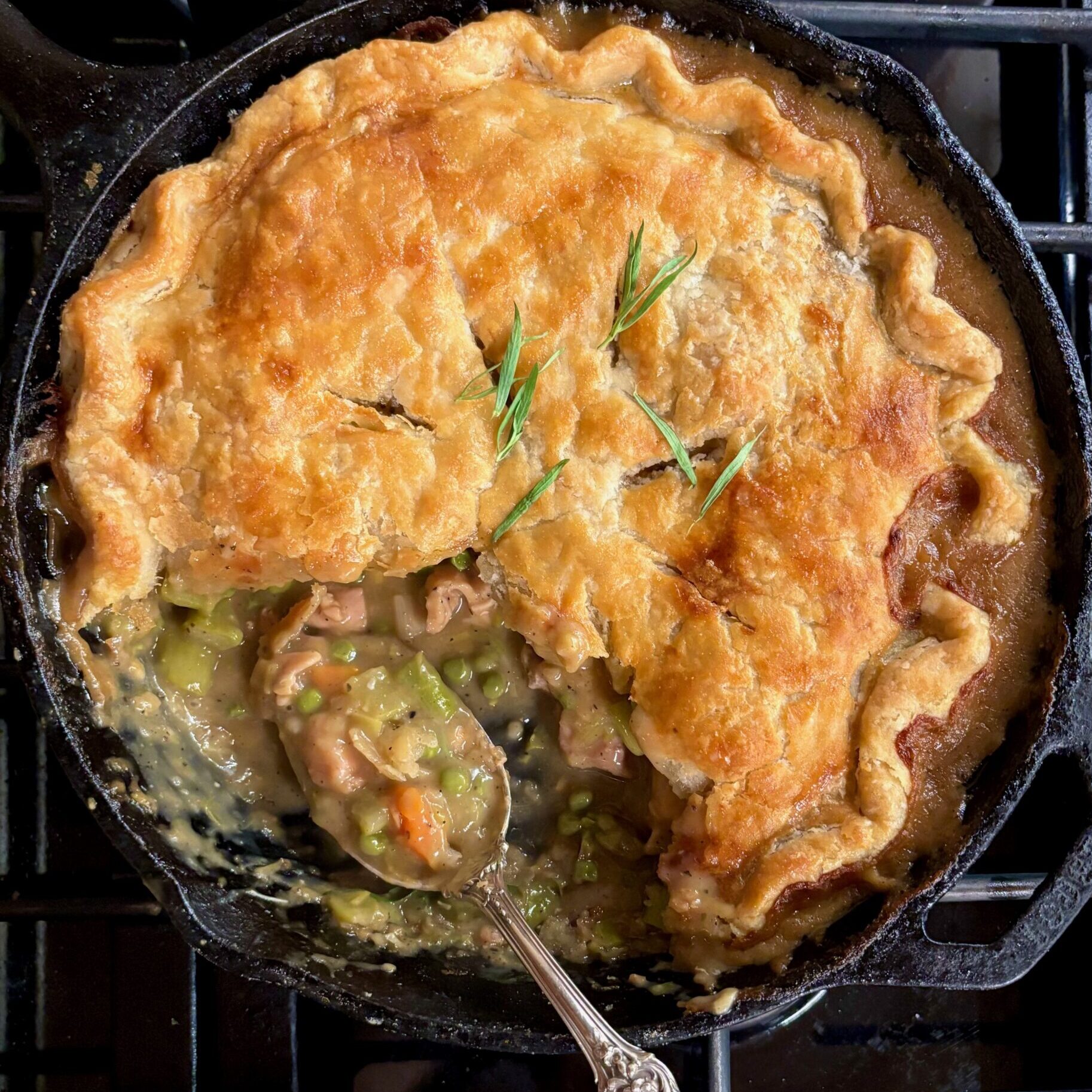 skillet pot pie on a black stovetop