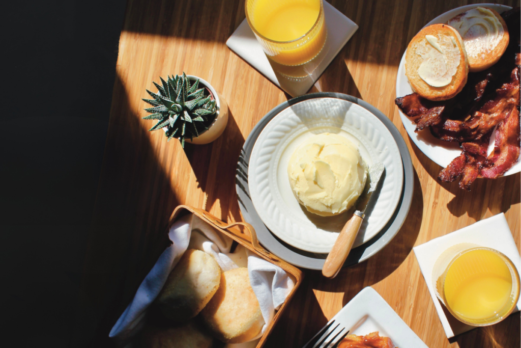 Mother's Day Brunch spread on a wooden table lit up by sun