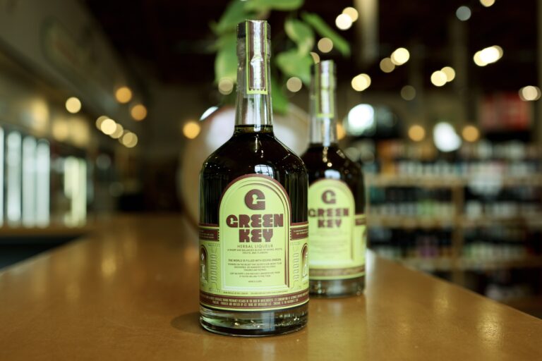Two bottles green key on the tasting bar
