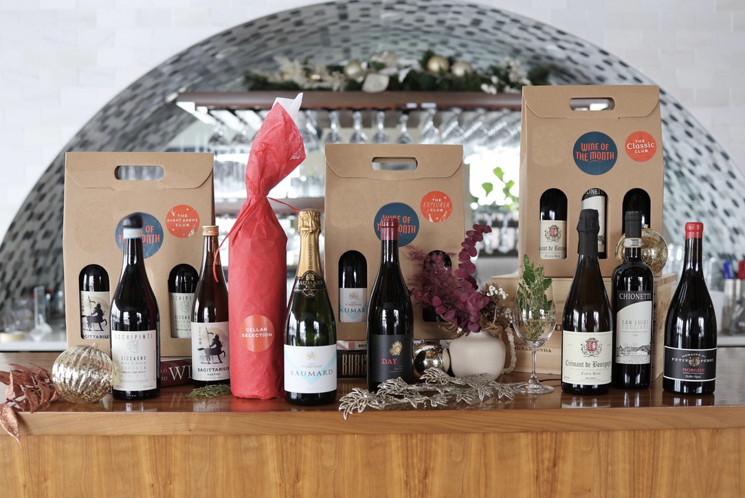 Bottles & 3 bottle packages lined up at the bar