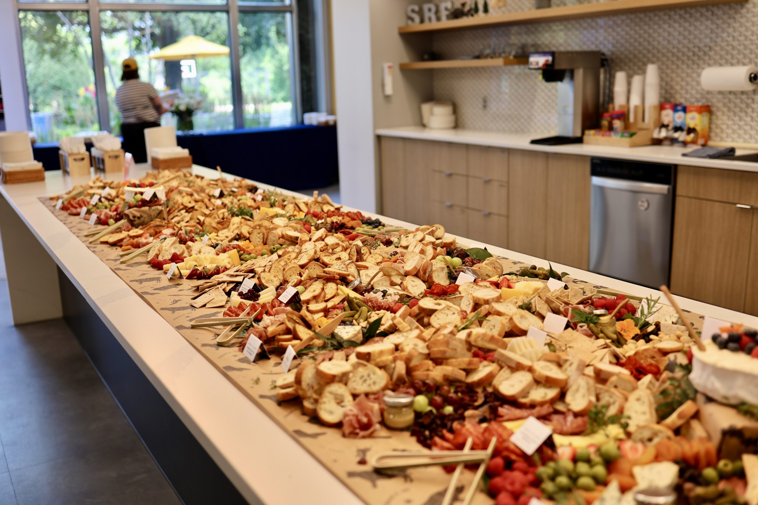 Large 100 person grazing table on a white counter