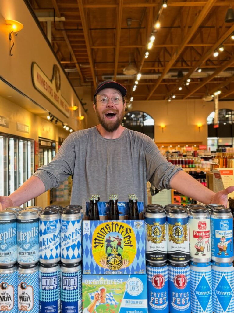 Stephen standing over a tower of Oktoberfest beers