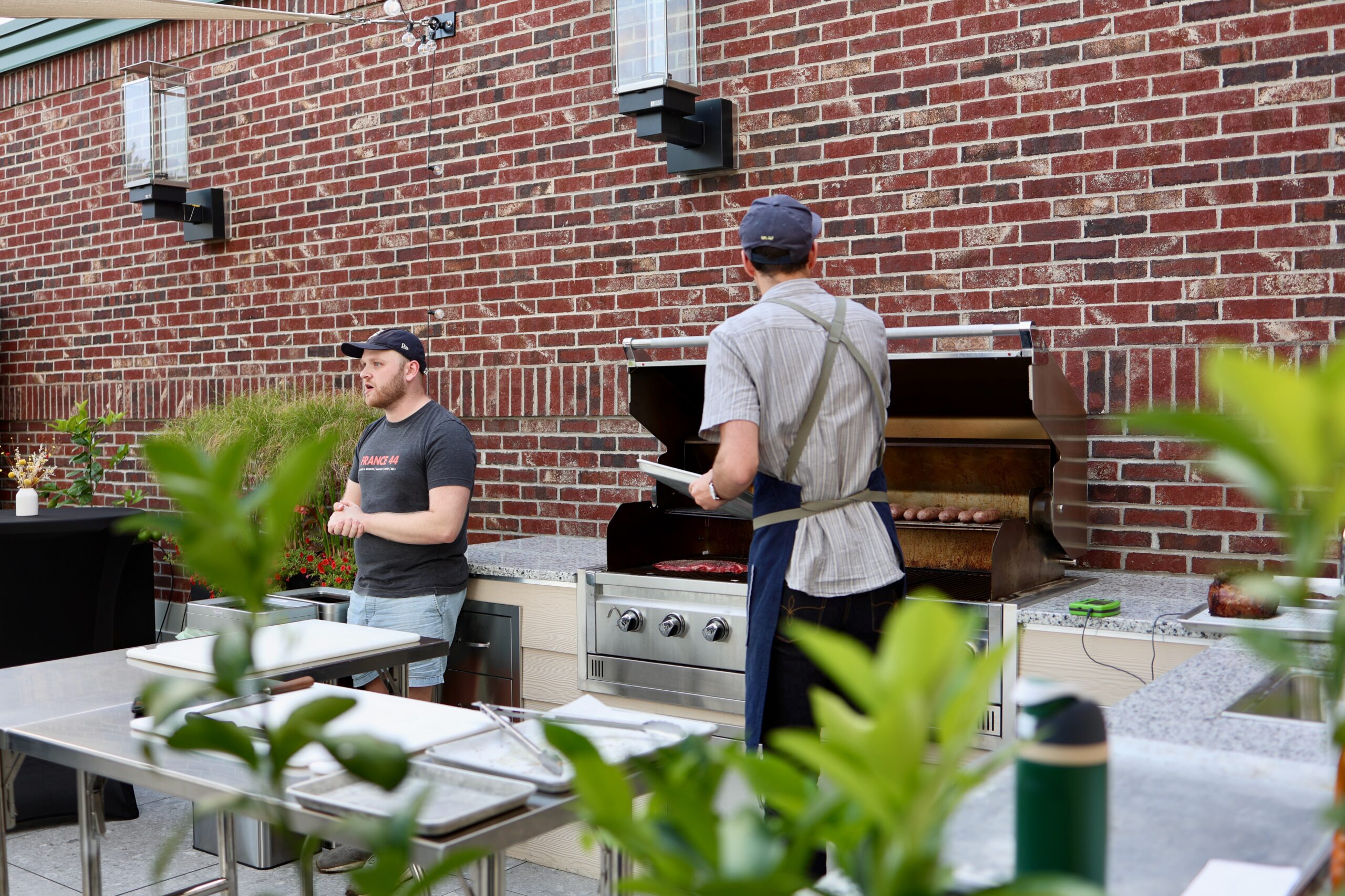 Grilling Station in front of a brick wall