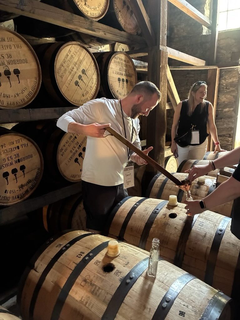 Bennett in the barrel room at a distillery in Kentucky
